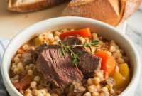 Hearty Beef and Barley Stew with Vegetables and Herbs