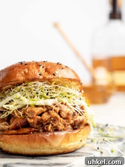 Slow Cooker BBQ Pulled Chicken Sandwich Recipe 5 chicken in slow cooker with honey bourbon bbq sauce