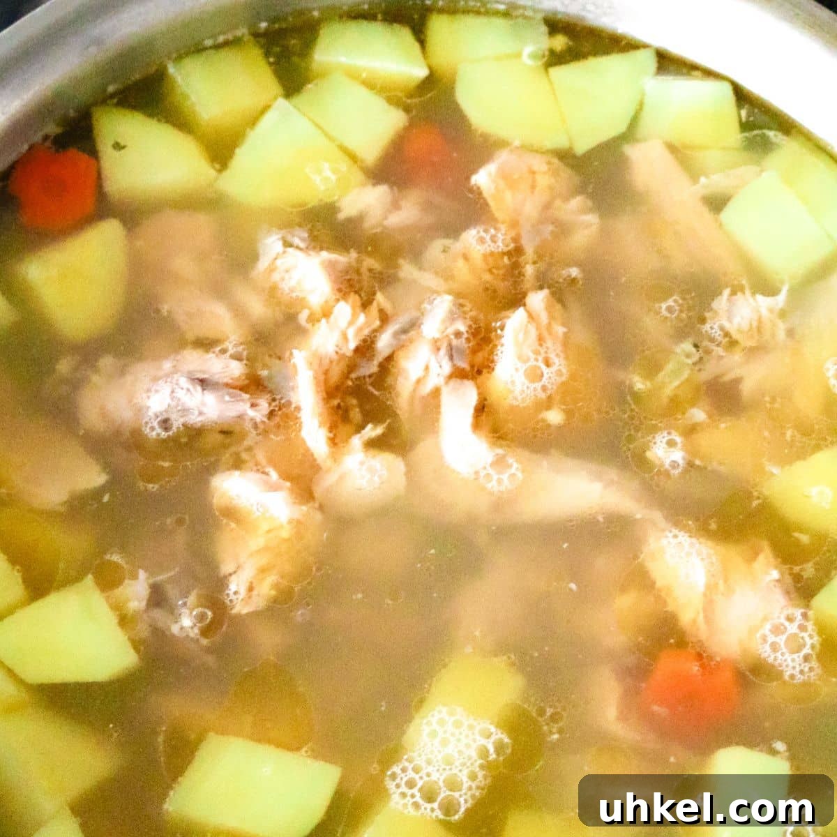 Authentic Ukha Fish Soup Recipe: Clear Russian Fisherman’s Broth 10 fish soup cooking in sauce pan