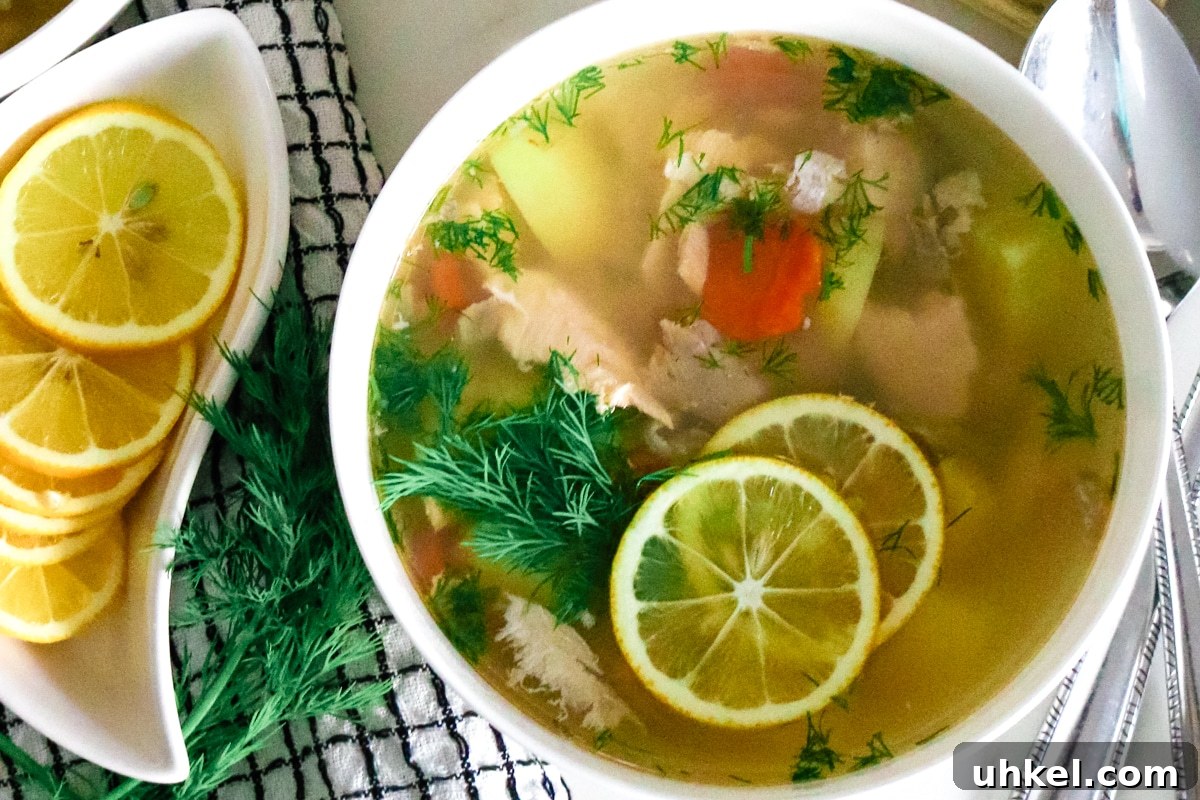 Authentic Ukha Fish Soup Recipe: Clear Russian Fisherman’s Broth 13 fish soup next to lemons and dill on black and white towel