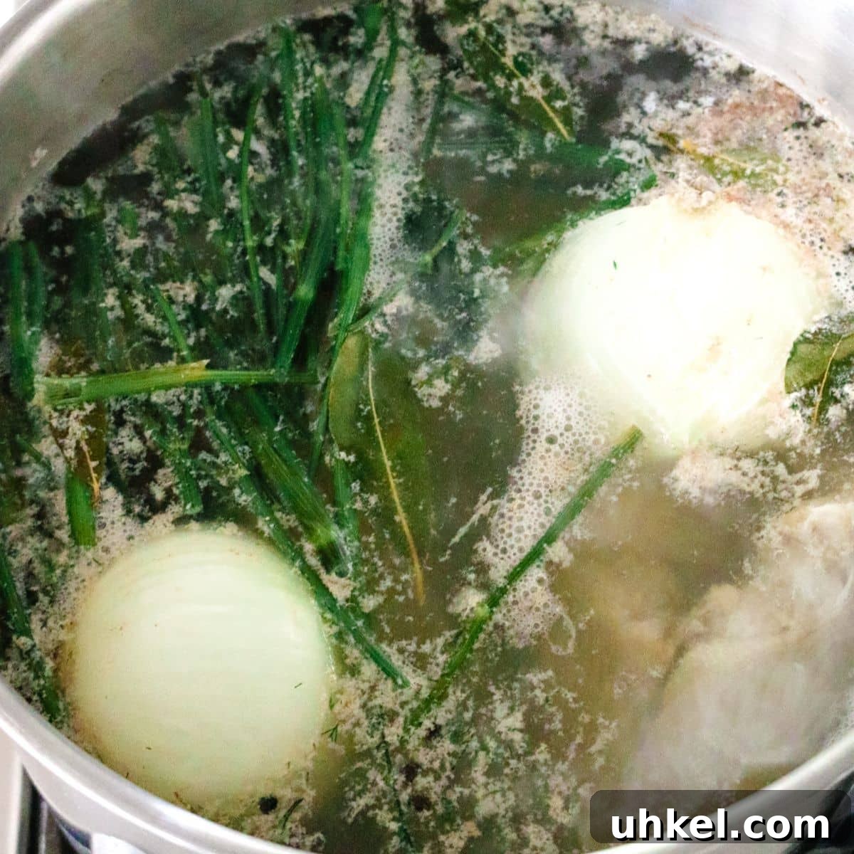 Authentic Ukha Fish Soup Recipe: Clear Russian Fisherman’s Broth 7 pot filled with uncooked fish stock