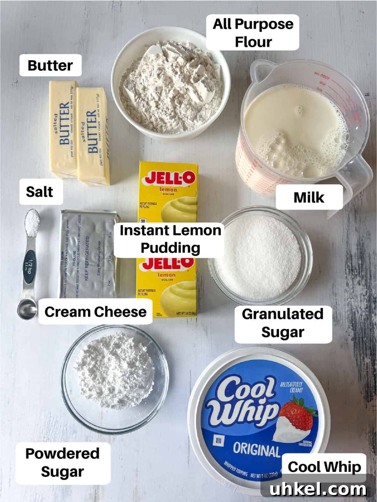 These super easy, nostalgic Lemon Lush is the perfect make-ahead dessert. Layers of creamy whipped topping, lemon pudding, and cheesecake all topped on the most delicious, buttery shortbread crust! Ingredient image for everything you need for a Lemon Lush dessert