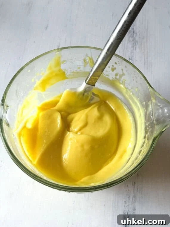 Decadent Lemon Lush Dessert with Graham Cracker Crust 4 A bowl of lemon pudding