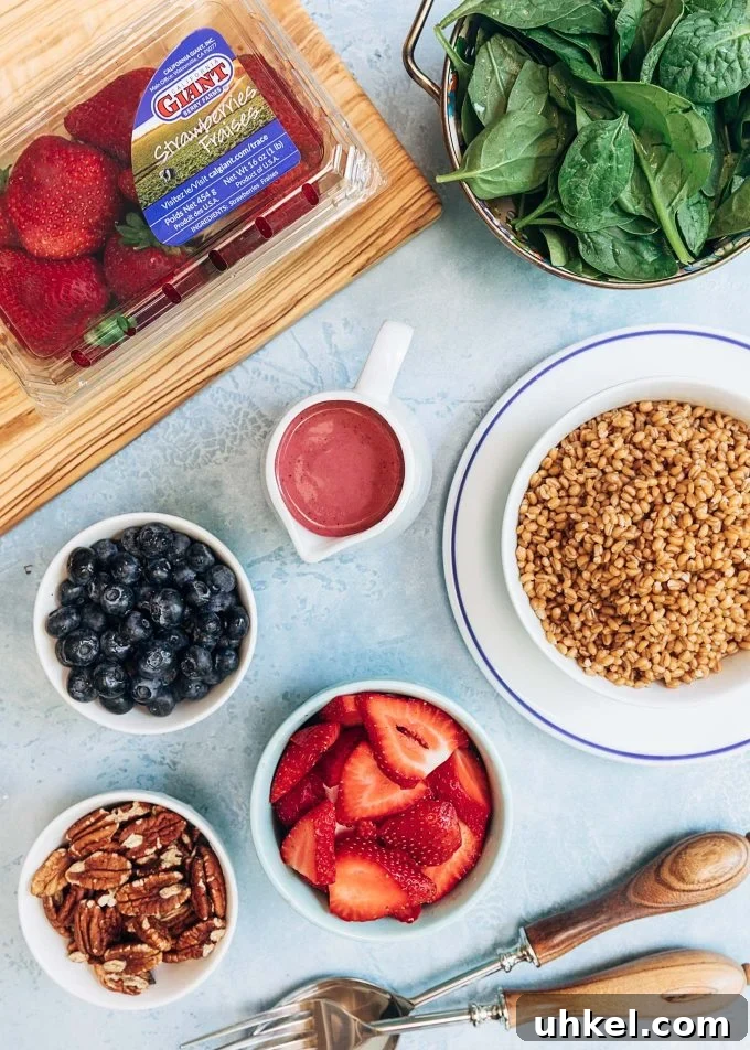 {sponsored} This Wheat Berry Salad with Mixed Berry Vinaigrette is an easy and healthy recipe that you can prep ahead for entertaining or for eating on the go. With toasted pecans, baby spinach, and goat cheese, and juicy berries, this sweet and savory salad is sure to become a lunch favorite. ingredients for mixed berry wheat berry salad {sponsored}