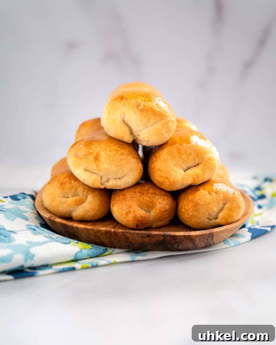 Ground Lamb Stuffed Buns Recipe – Savory Meat-Filled Bread 4 Table view of baked meat-filled buns in a stack of six.