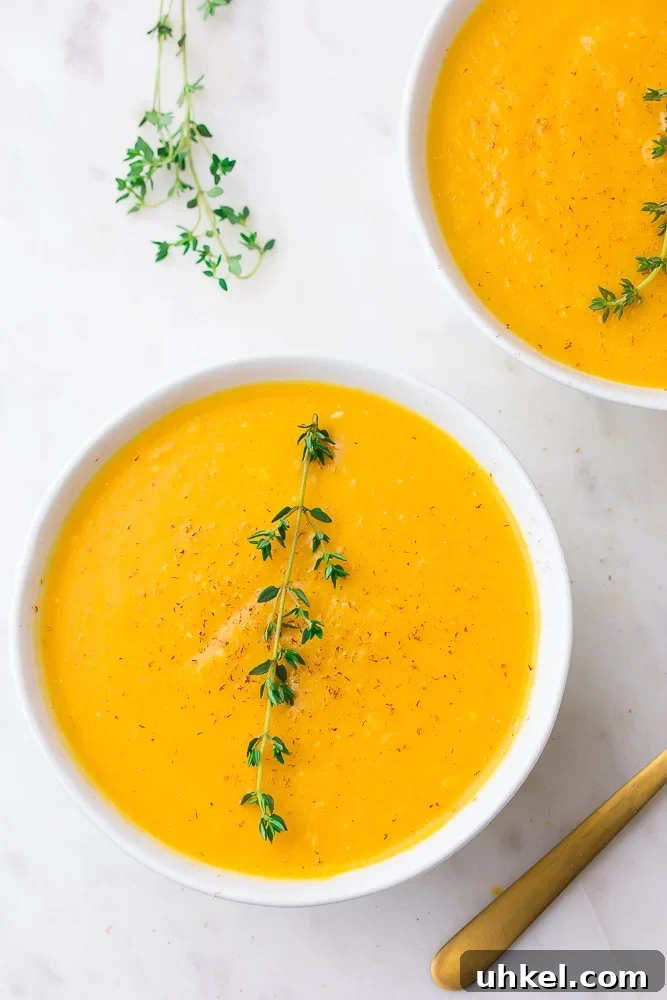 Creamy Instant Pot Butternut Squash Soup Recipe 2 2 bowls of instant pot butternut squash soup with thyme, white background