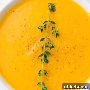 Creamy Instant Pot Butternut Squash Soup Recipe 7 close up of a bowl of instant pot butternut squash soup with thyme