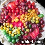 Ultimate Tomato Galette Recipe You’ll Make Again and Again 10 a raw and round tomato galette with red, orange, yellow and green tomatoes