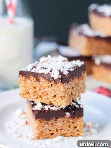Chocolate Peppermint Rice Crispy Treat stacked two high on a plate.