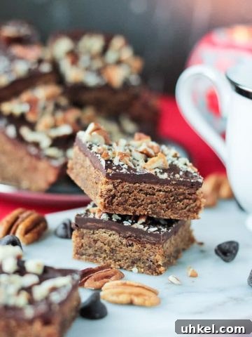 Two stack dessert bars on a marble serving tray.