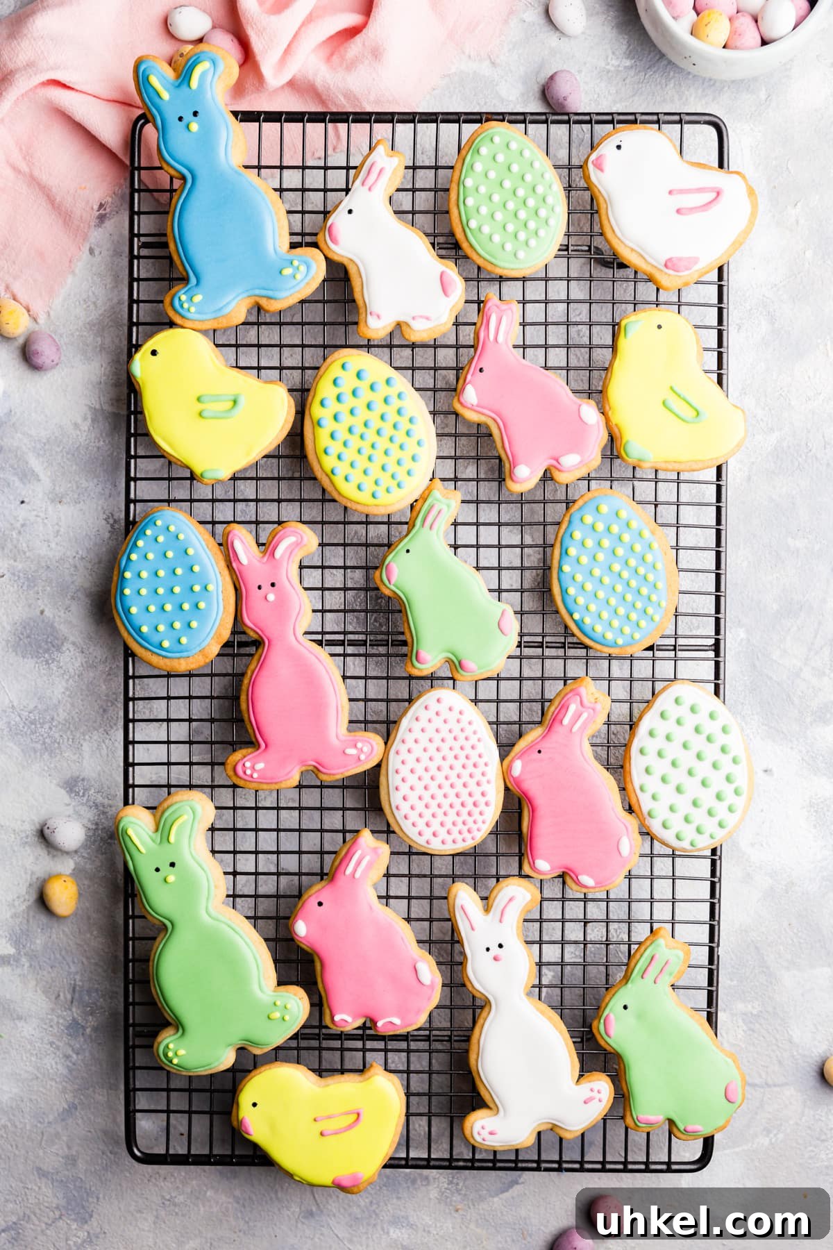 Easter Sugar Cookie Recipe with Simple Decorating Ideas 8 top view of Easter sugar cookies with royal icing on a wire rack