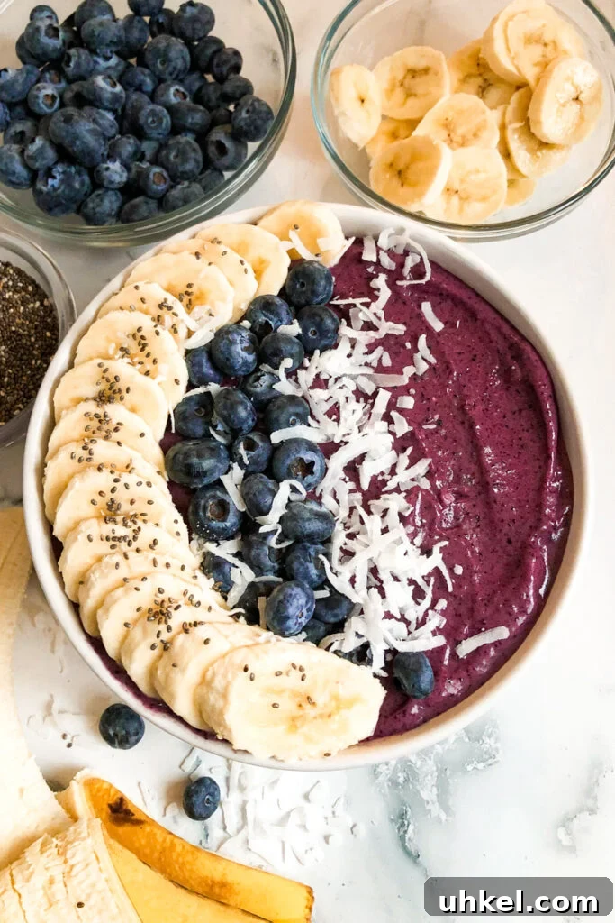 Blueberry Smoothie Bowl Recipe for Creamy, Antioxidant-Rich Mornings 2 blueberry smoothie bowl with sliced bananas, fresh blueberries, and chia seeds.