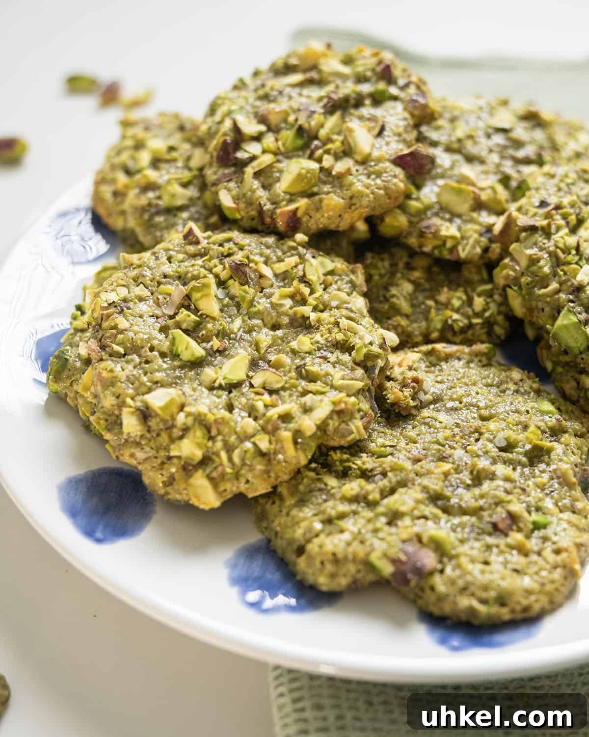 Authentic Italian Pistachio Cookies Recipe for Crispy, Nutty Treats 9 Italian pistachio cookies on a plate.