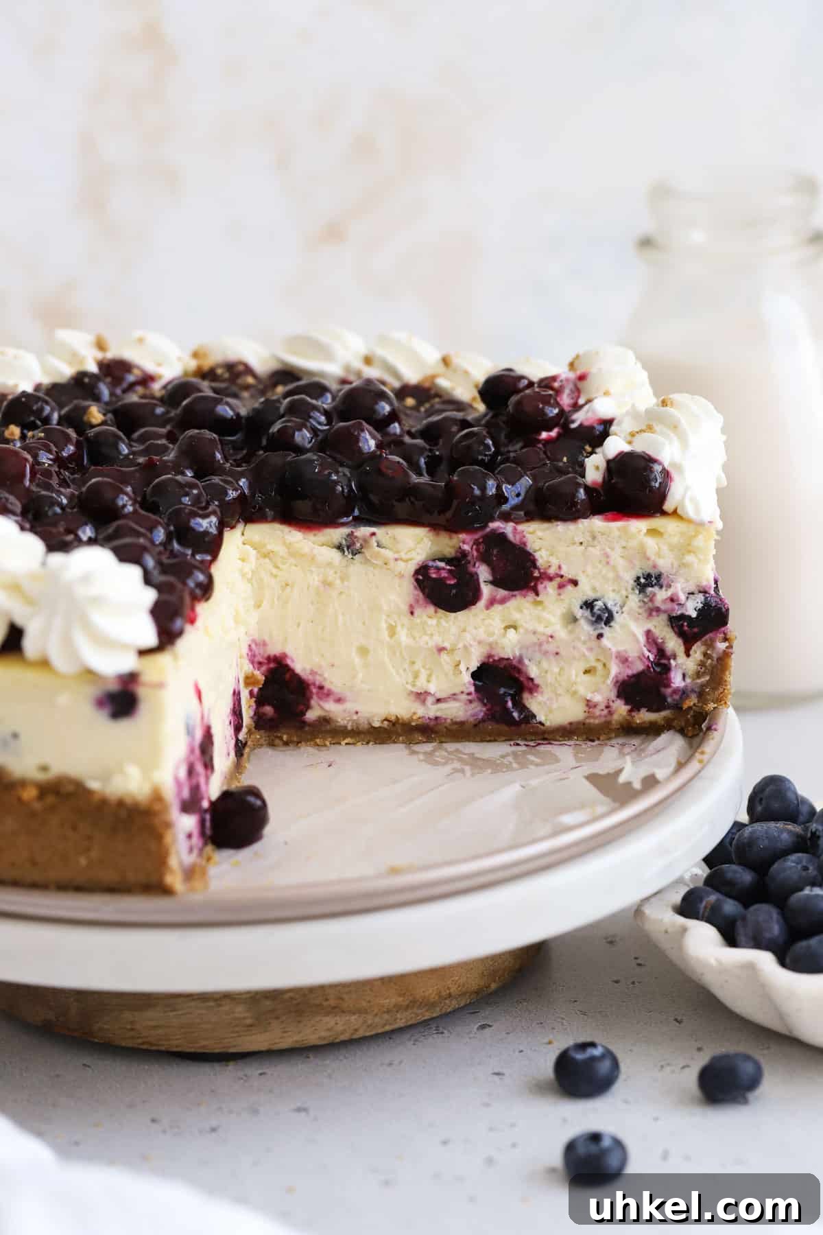 Gluten-Free Blueberry Cheesecake Recipe with Creamy Filling 7 gluten-free blueberry cheesecake with whipped cream and fresh blueberry topping