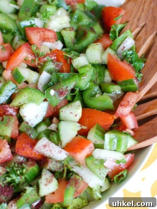 Lebanese Vegetable Medley: Classic Recipes and Flavor Guide 11 Easy Lebanese Salad in white bowl with wooden spoons
