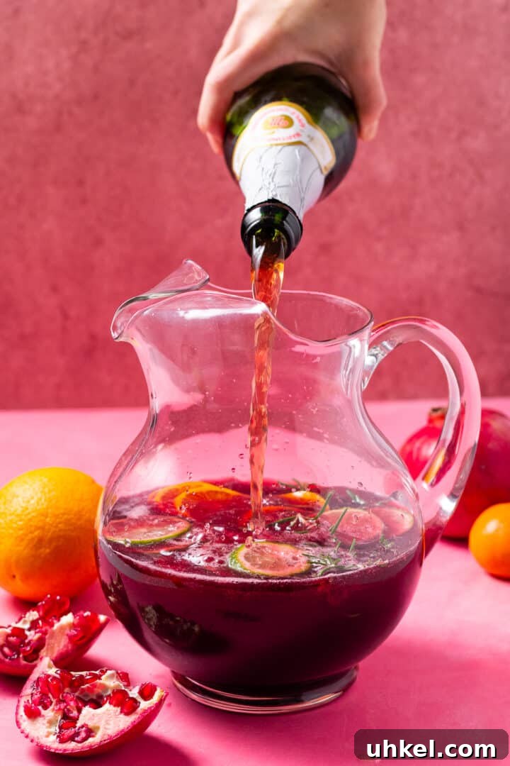 pouring sparkling apple juice in the pitcher