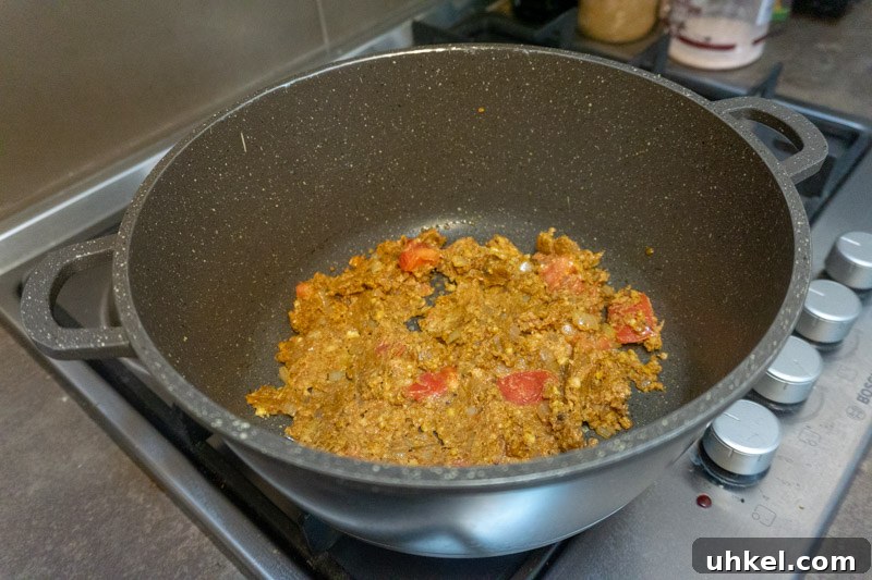 Megrelian Kharcho: Authentic Georgian Beef Stew with Walnuts 4 Mixing in the walnuts and spices