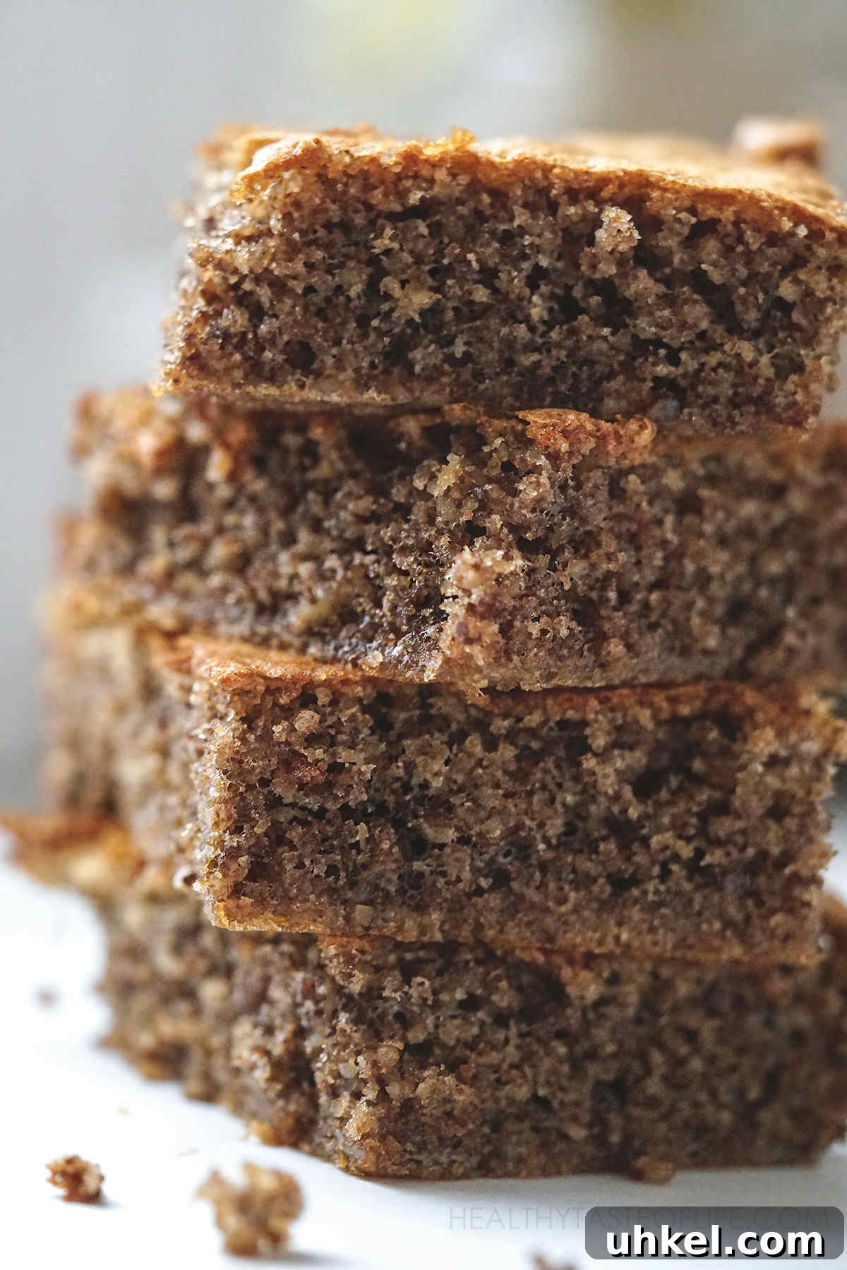 Greek-Inspired Walnut Cake with Gluten-Free Option 4 Close up shot of walnut sheet cake, walnut coffee cake cut and stacked.