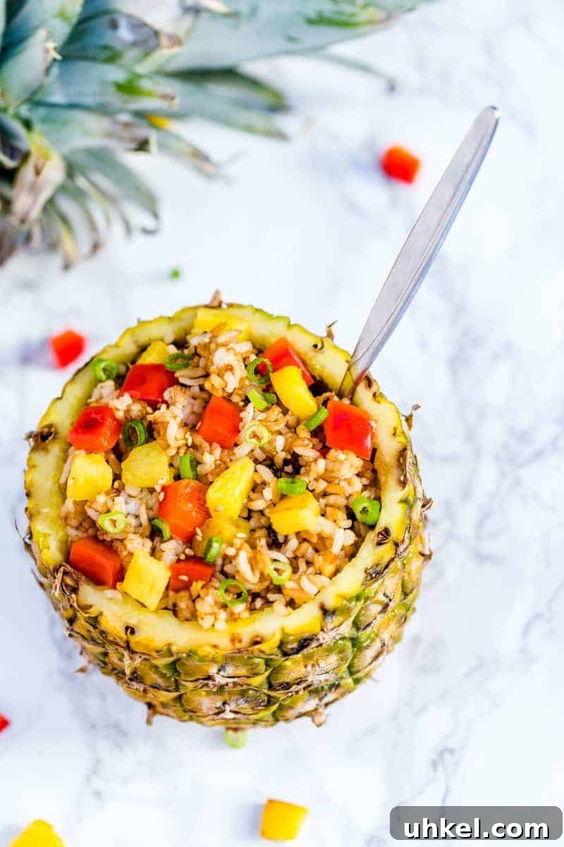 Authentic Thai Pineapple Fried Rice with Cashews 4 A pineapple filled with fried rice.