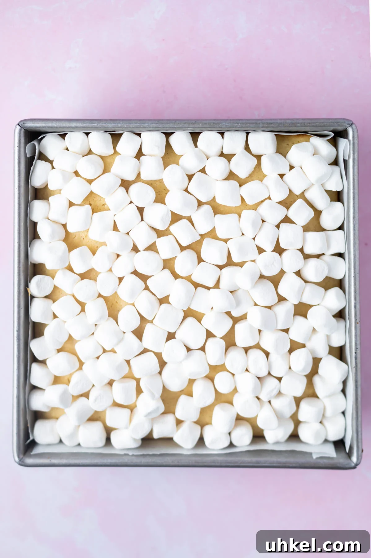 mini marshmallows added over the top of the baked vanilla crumb