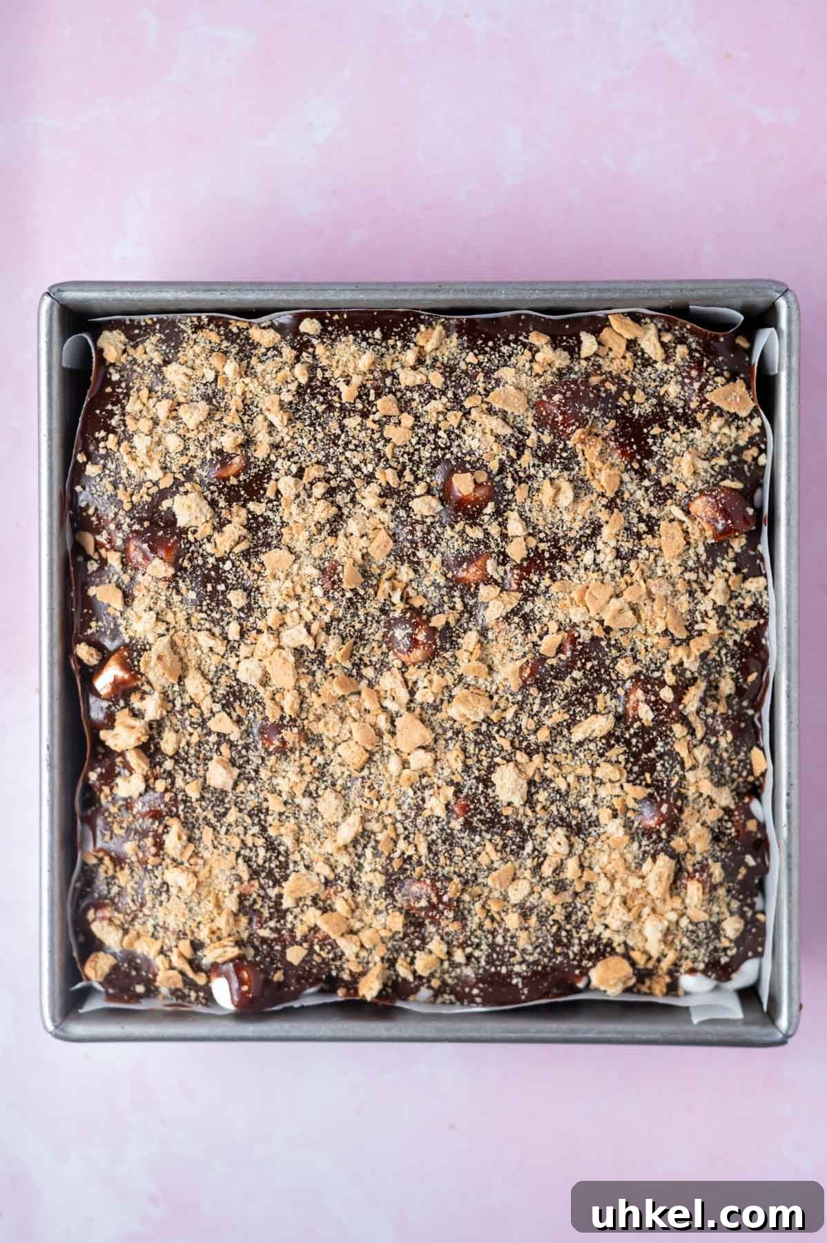graham cracker crumbs sprinkled over chocolate ganache frosting