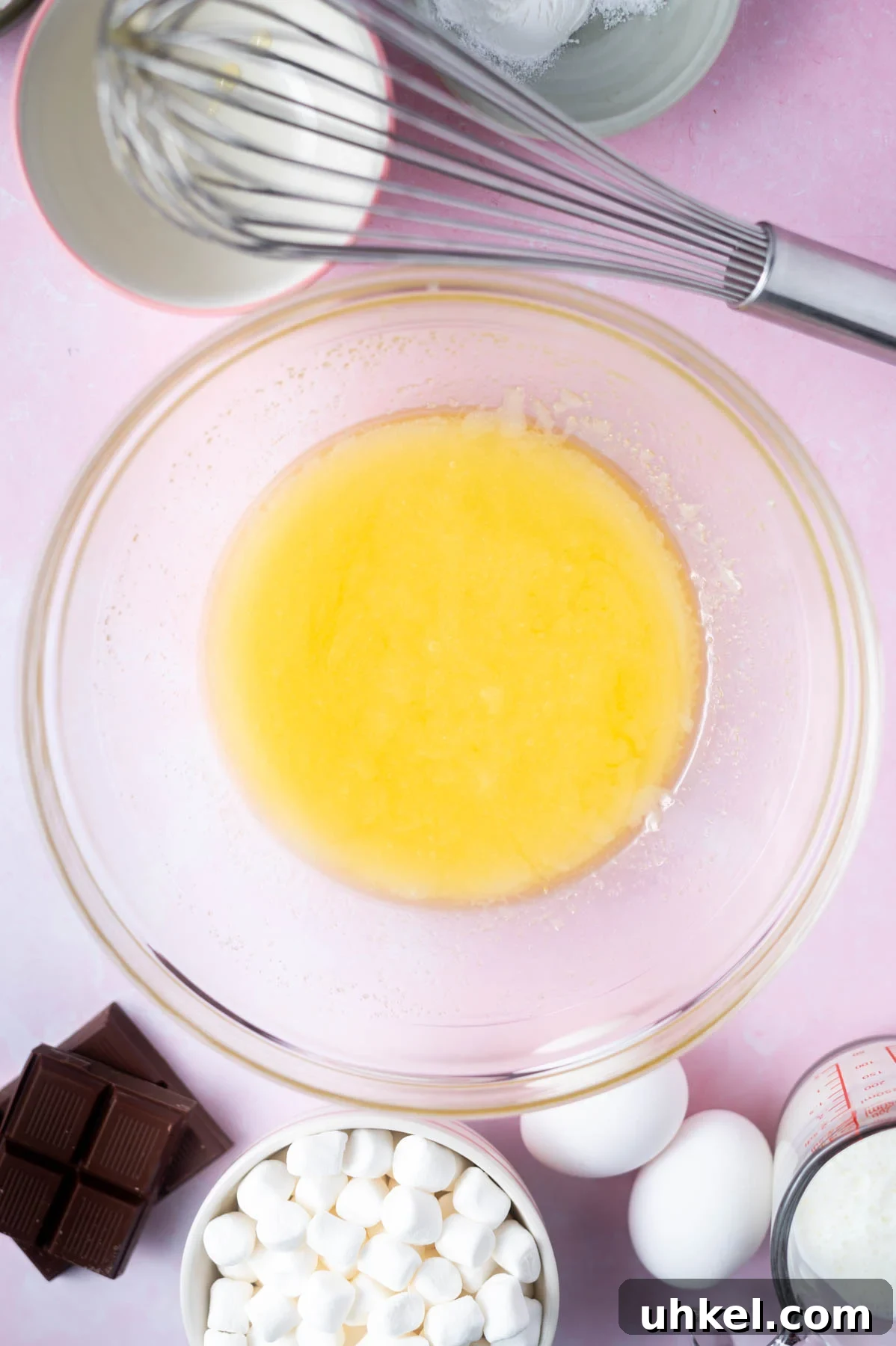 melted butter and sugar whisked together in a glass bowl