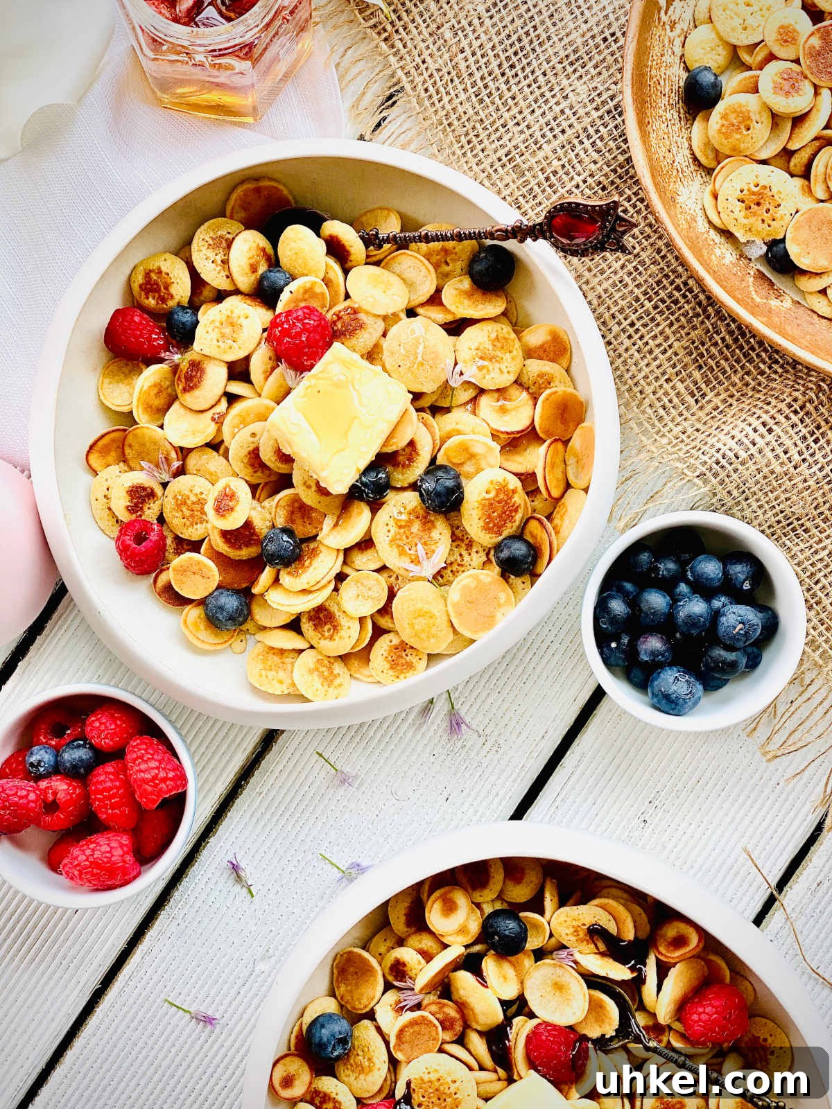 Mini Pancake Cereal Recipe: Bite-Sized Pancakes for Breakfast 3 mini pancakes with blueberries and raspberries