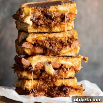 Grilled Cheese Chili-Cheese Dog Sandwich Recipe 2 4 sandwich halves stacked with chili spilling out