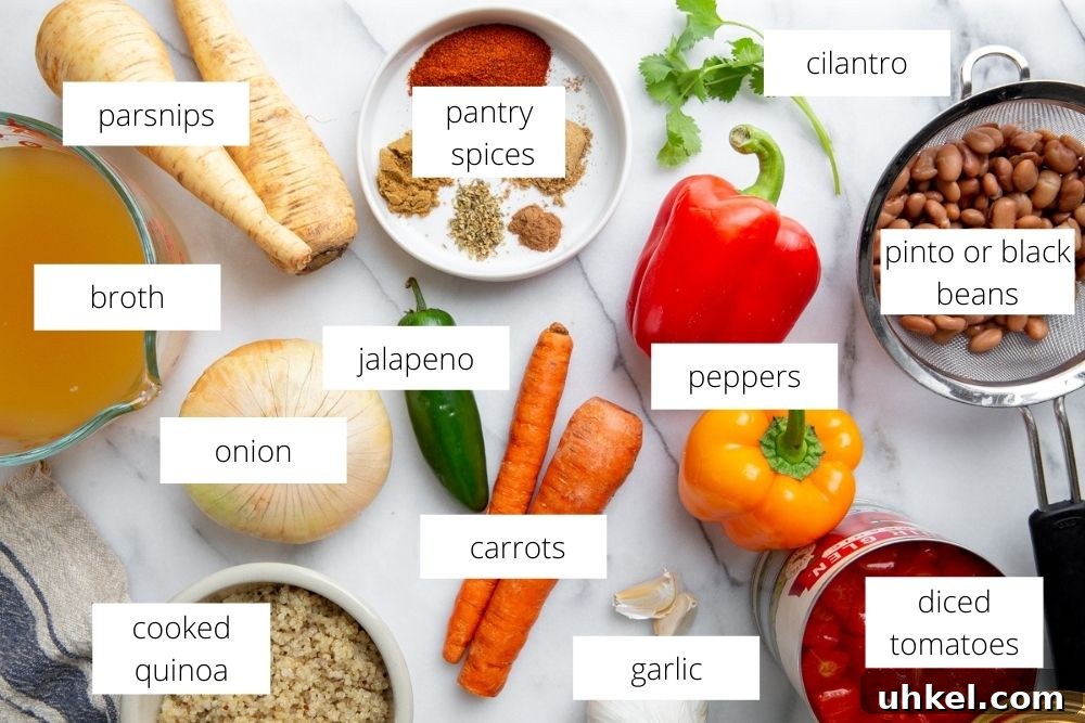 Hearty Vegan Quinoa Chili Recipe: Protein-Packed & Flavorful 4 All of the ingredients for the vegetable quinoa chili recipe arranged on a marble surface with labels.