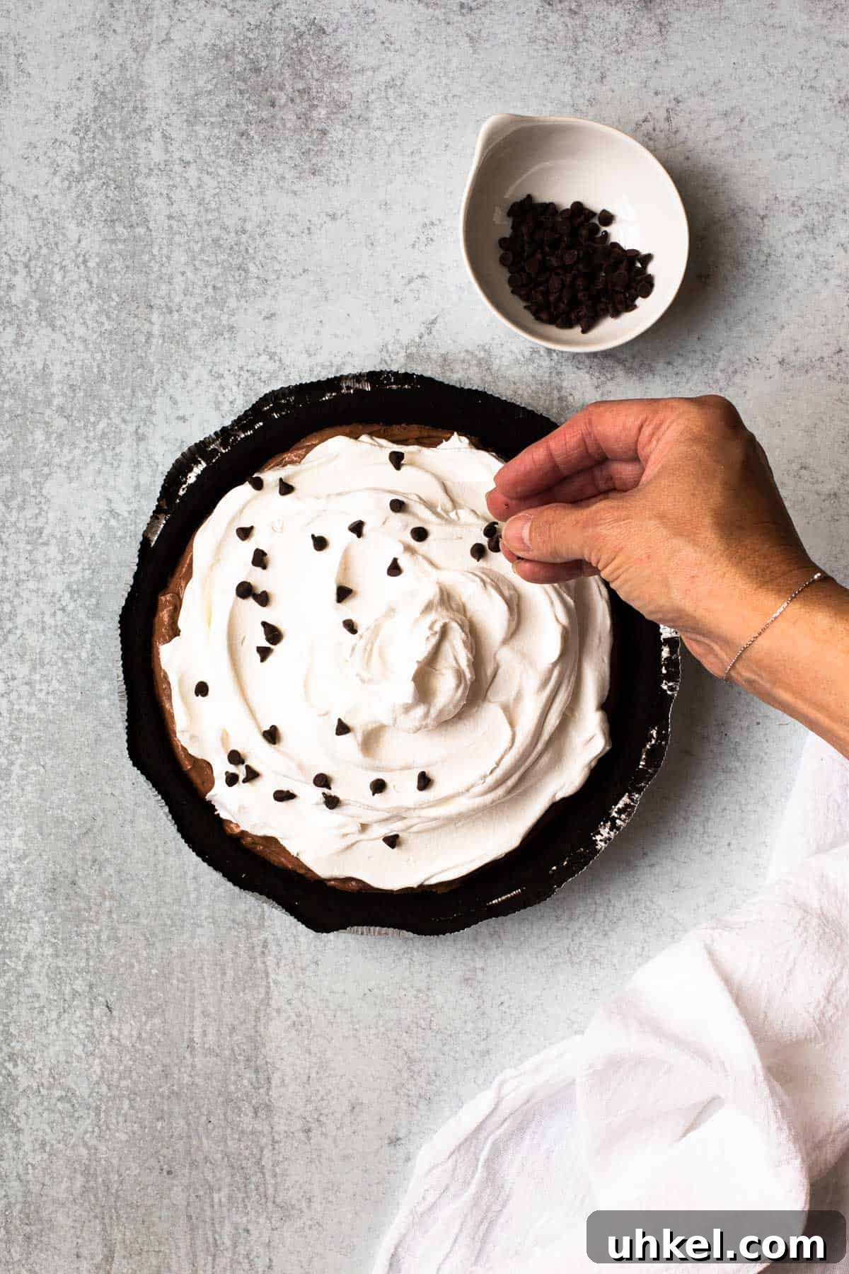 No-Bake Chocolate Pudding Pie with Cool Whip and Jell-O 6 overhead view of adding chocolate chips to finished pie