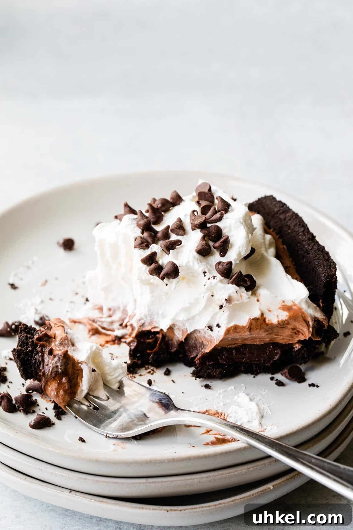 No-Bake Chocolate Pudding Pie with Cool Whip and Jell-O 8 close up view of chocolate pie on a plate with a bite on a fork
