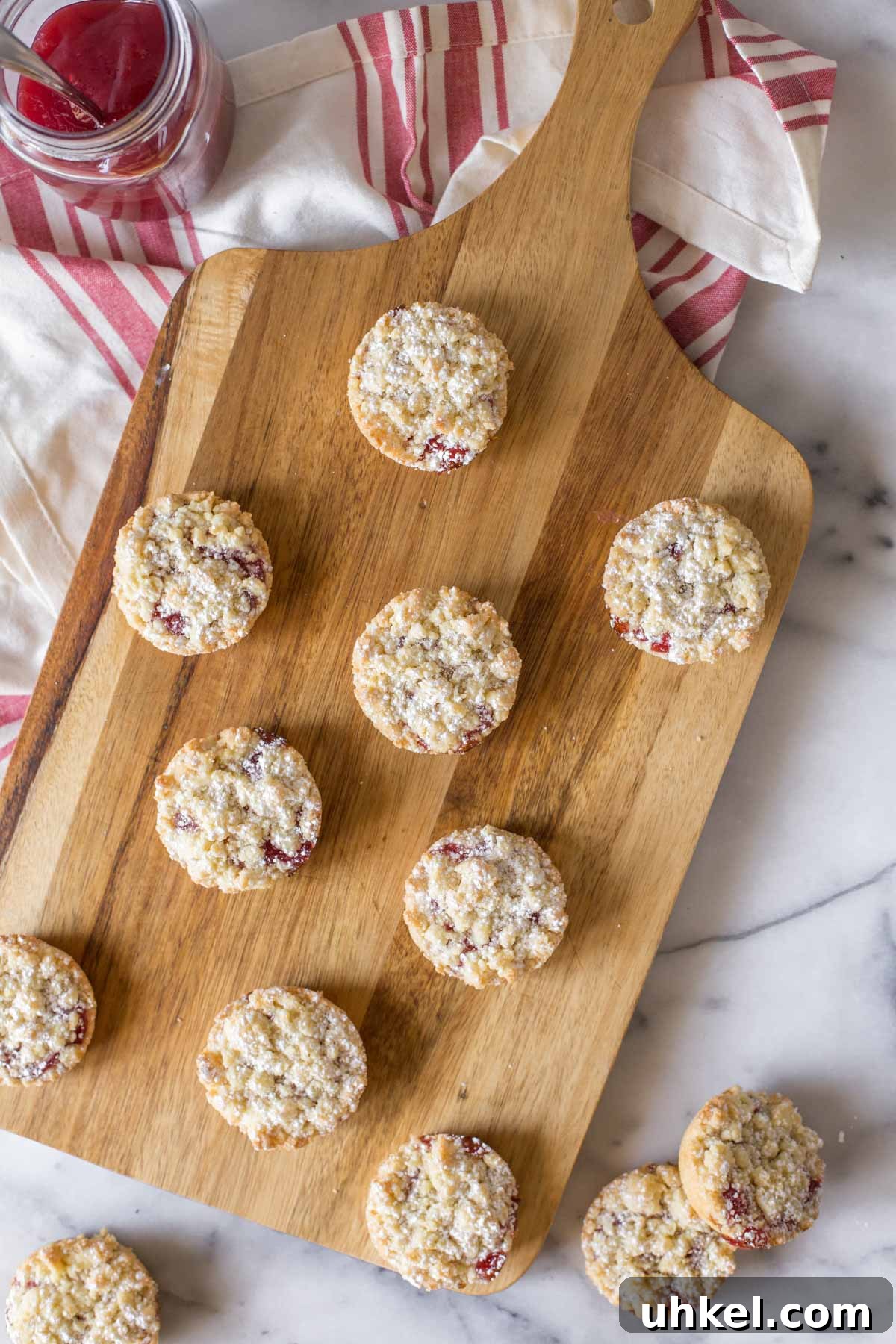 Costco Raspberry Crumble Cookies Review & Where to Buy 49 Overhead shot of Costco Raspberry Crumble Cookies on a wooden cutting board.