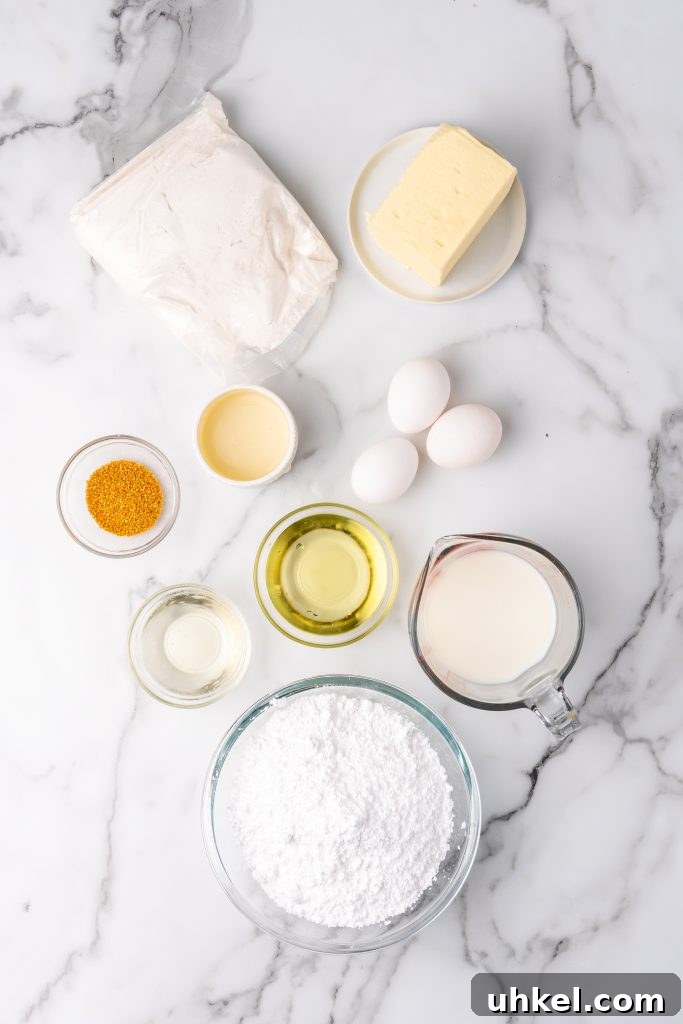 Champagne-Infused Cupcakes: Sparkling Celebration Recipe 4 an overhead image showing the measured ingredients needed to make a batch of champagne cupcakes