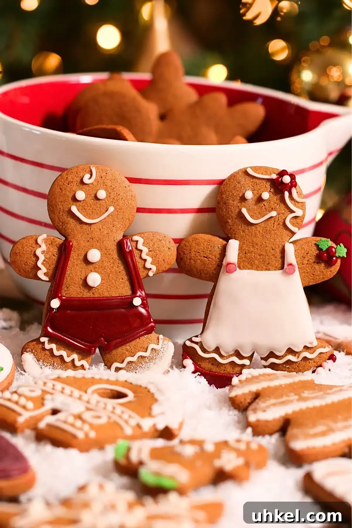 7 Pro Tips for Baking Perfect Cookies Every Time 12 homemade gingerbread cookies decorated with loyal icing, laid on a pile of snow
