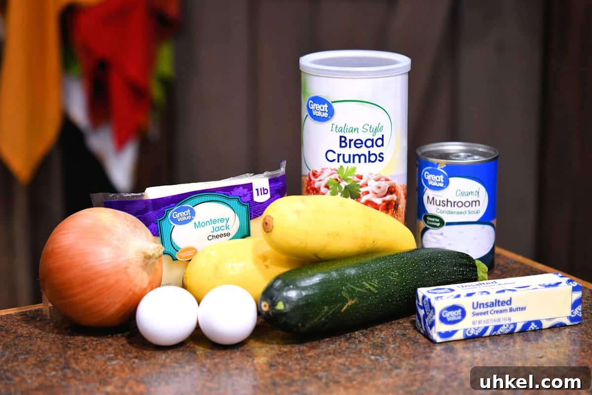 Cheesy Zucchini and Summer Squash Casserole Recipe 3 ingredients for zucchini casserole on a countertop