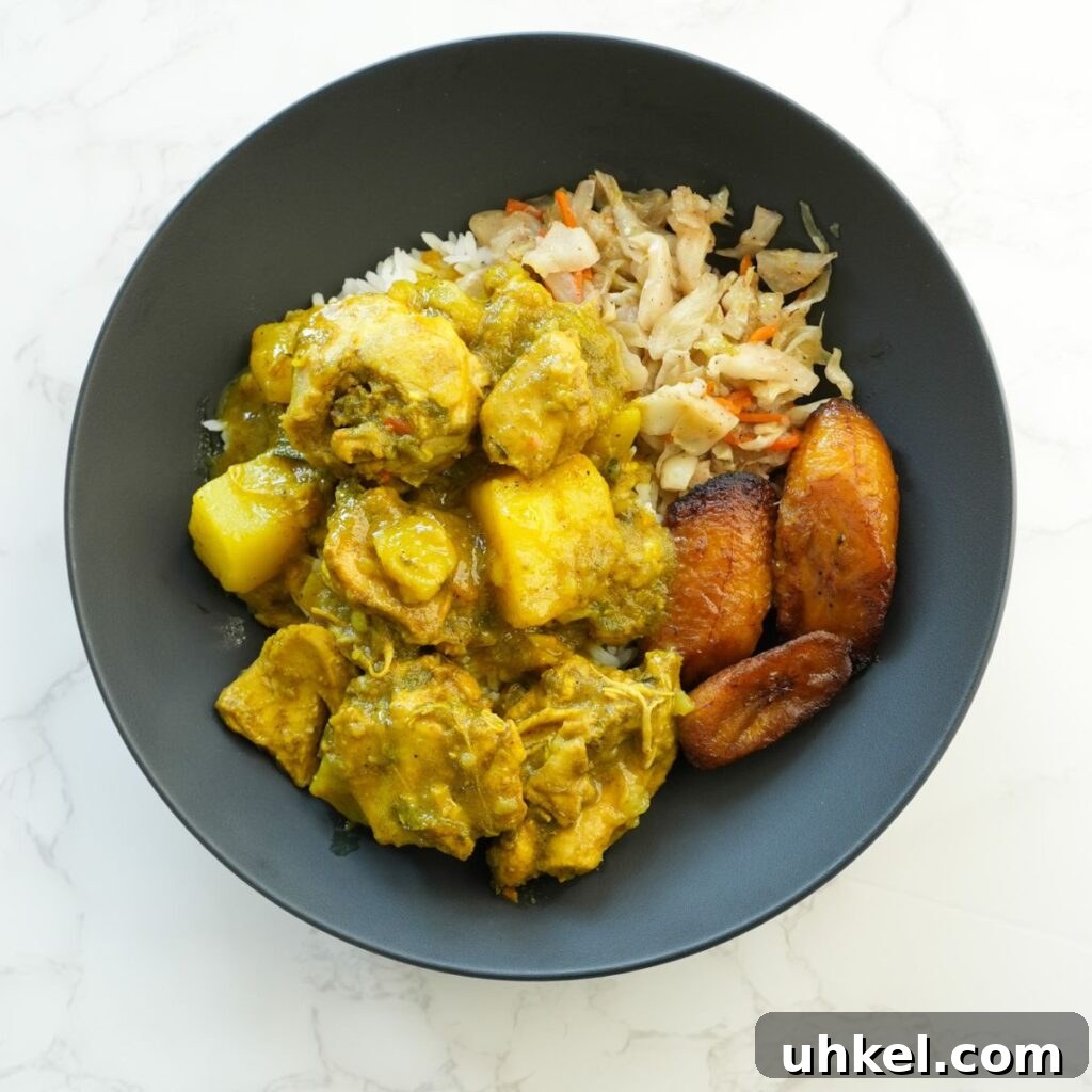 Authentic Jamaican Curry Chicken Recipe: Rich Island Flavor 2 Jamaican curry chicken with tender chicken pieces, potatoes, and vibrant spices served over rice.