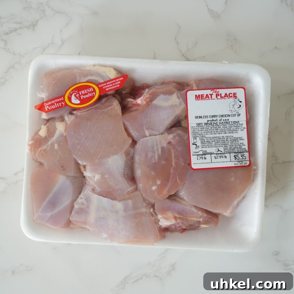 Authentic Jamaican Curry Chicken Recipe: Rich Island Flavor 3 Skinless curry chicken cut up in a package.