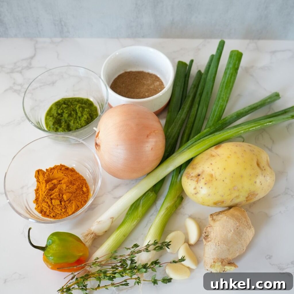 Authentic Jamaican Curry Chicken Recipe: Rich Island Flavor 5 scallions, potato, ginger, thyme, garlic cloves, scotch bonnet pepper, curry powder, onion, adobo and green seasoning