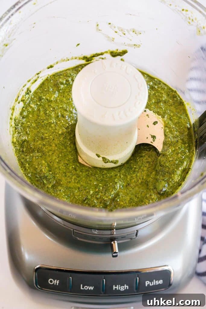 Classic Basil Pesto Recipe: Fresh, Vibrant Sauce for Pasta & More 9 pesto sauce in a food processor