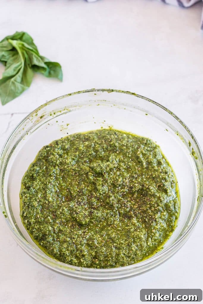 Classic Basil Pesto Recipe: Fresh, Vibrant Sauce for Pasta & More 11 pesto sauce in a small bowl