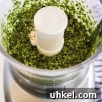 Classic Basil Pesto Recipe: Fresh, Vibrant Sauce for Pasta & More 15 pesto mixture in a food processor