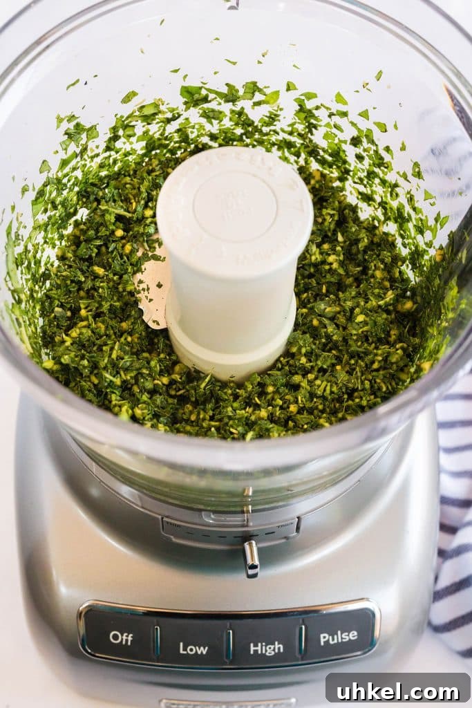 Classic Basil Pesto Recipe: Fresh, Vibrant Sauce for Pasta & More 7 pesto mixture in s food processor
