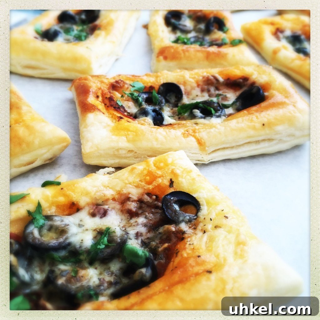 30-Minute Family Dinner Recipes Your Whole Family Will Love 10 puff pastry pizza topped with pesto, ham and olives and mozzarella