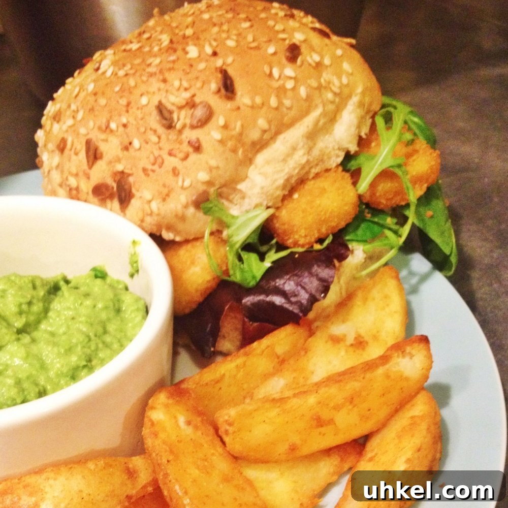 30-Minute Family Dinner Recipes Your Whole Family Will Love 17 fish fingers on toasted roll with rocket salad, alongside portion of potato wedges and homemade pesto pea dip