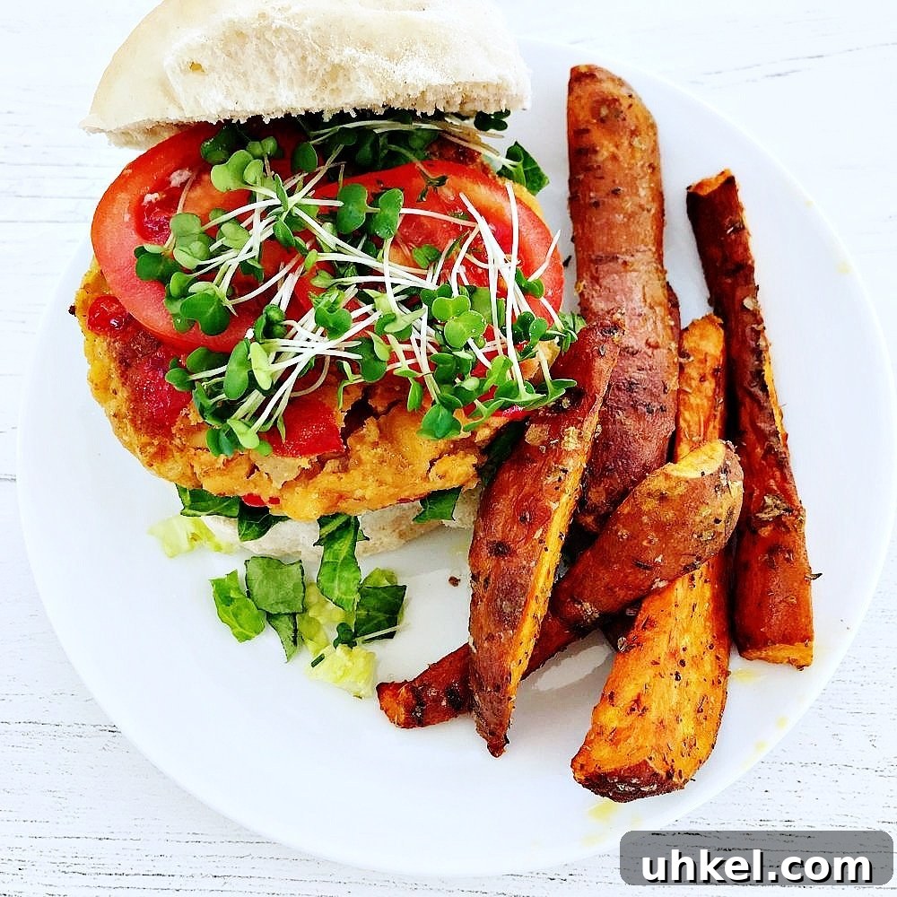 30-Minute Family Dinner Recipes Your Whole Family Will Love 18 homemade vegan burger recipe served on bread roll with tomato slices, cress and a side of homemade sweet potato wedges