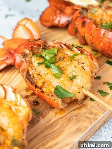 Smoked lobster tails on cutting board seasoned