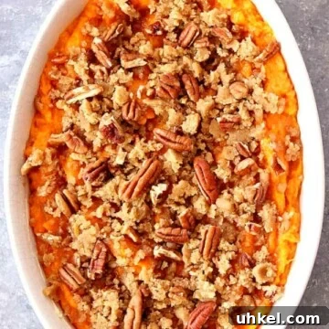 Sweet Potato Casserole with Brown Sugar Pecan Topping 3 Sweet Potato Casserole in a white dish.