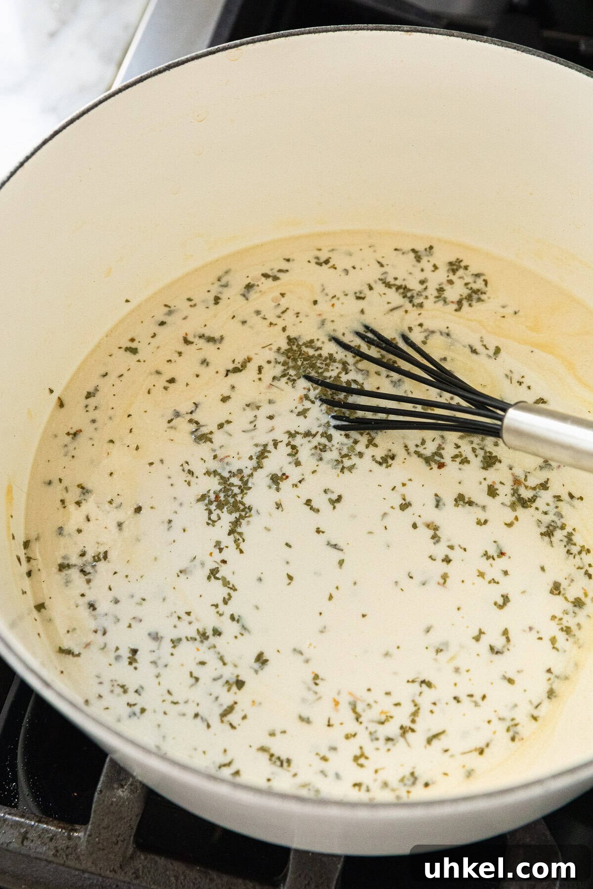 Olive Garden Chicken and Broccoli Copycat Recipe 8 Adding heavy cream to make the sauce.