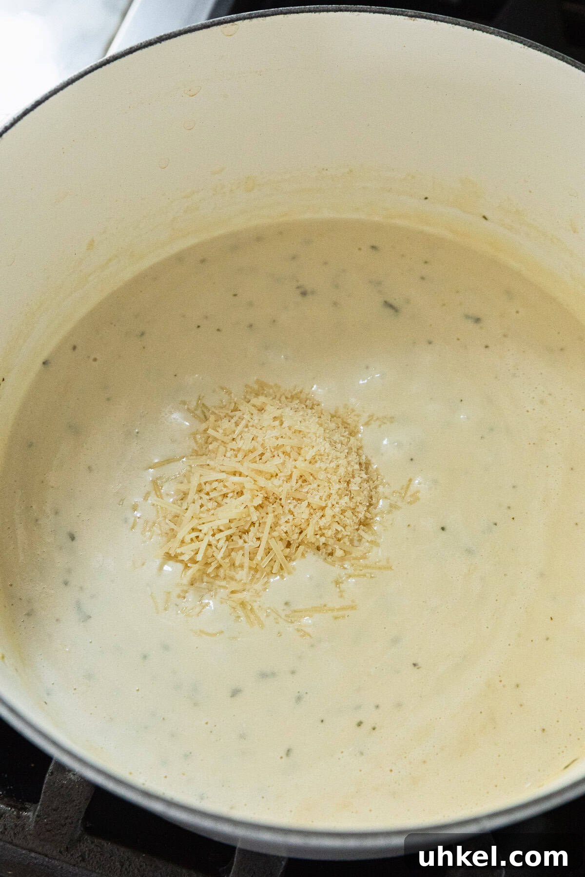 Olive Garden Chicken and Broccoli Copycat Recipe 9 Adding parmesan cheese to make the cheese sauce.
