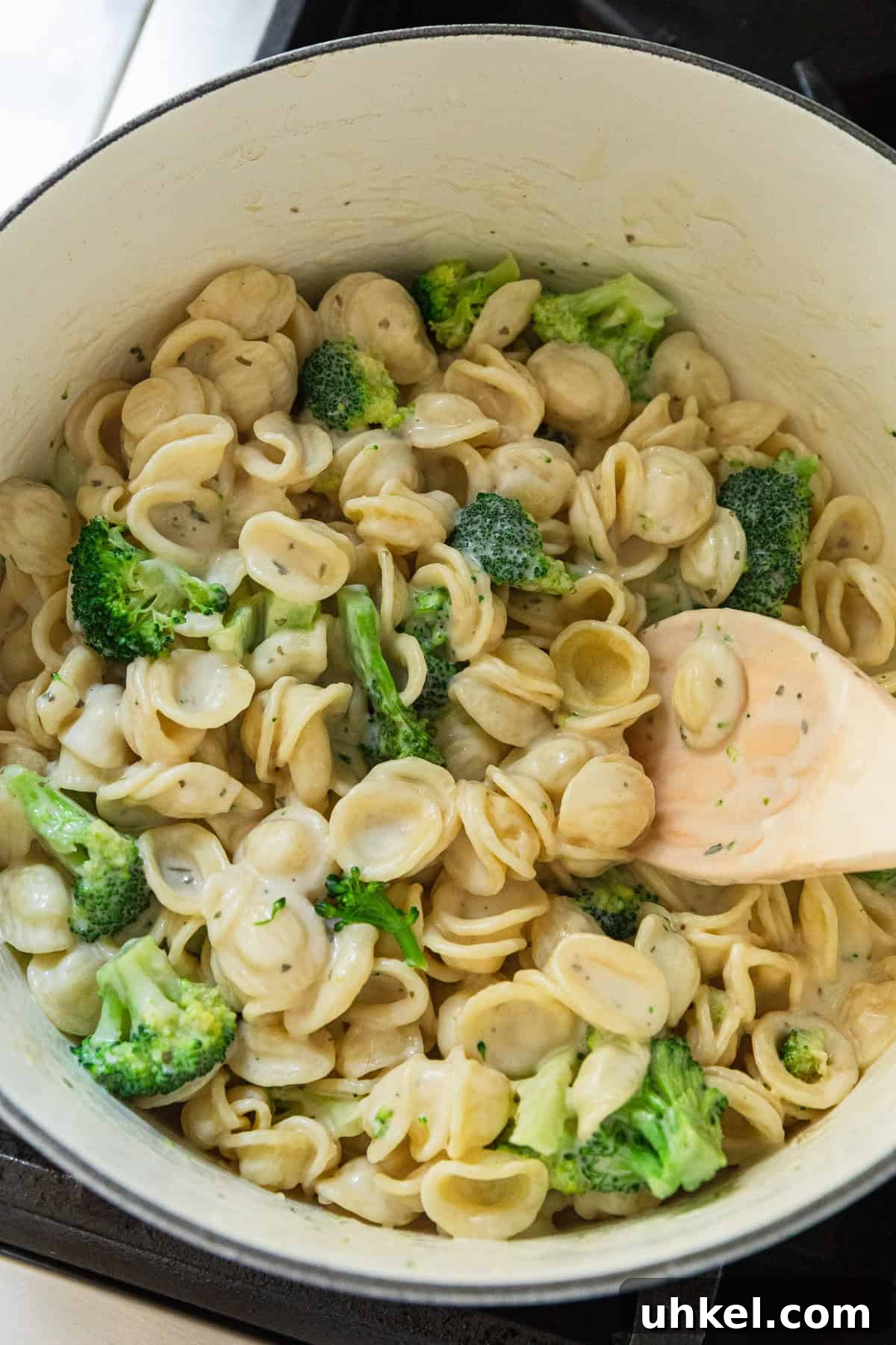 Olive Garden Chicken and Broccoli Copycat Recipe 10 Adding pasta and broccoli to the cheese sauce.